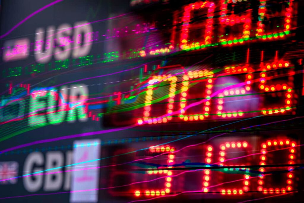 Close-up of an electronic currency exchange display board showing USD, EUR, and GBP tickers used for forward contracts,  exchange rates. 